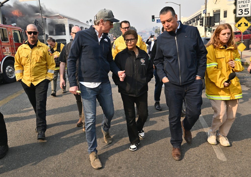 Los Angeles Mayor Karen Bass, joins California Governor Gavin Newsom, left, and State Senator Alex Padilla while surveying damage during the Palisades Fire on Wednesday, January 8, 2025, in Pacific Palisades.