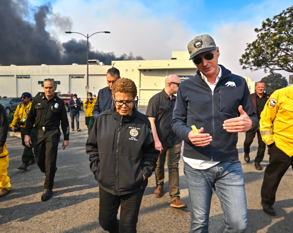 Los Angeles Mayor Karen Bass, chats with California Governor Gavin Newsom while surveying damage during the Palisades Fire on Wednesday, January 8, 2025.