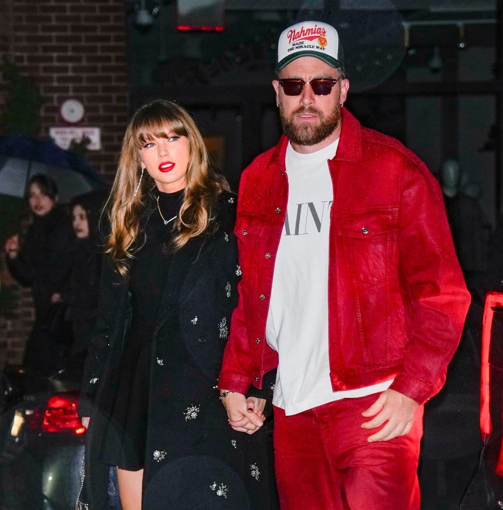 Travis Kelce and Taylor Swift holding hands in December 2024.