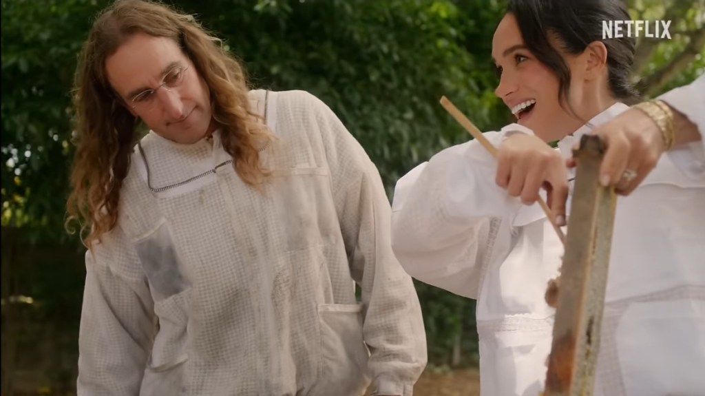 Meghan Markle laughs while beekeeping