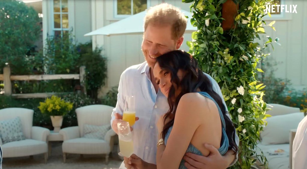 Meghan Markle and Prince Harry hugging.