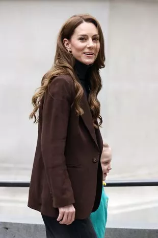 Kate Middleton at the National Portrait Gallery wearing a brown blazer