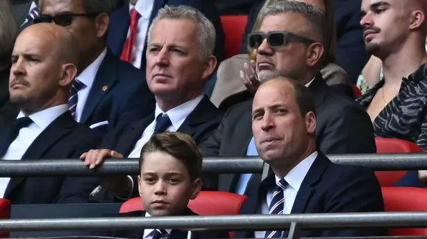 Britain's Prince George of Wales (L) and Britain's Prince William, Prince of Wales attend the English FA Cup final football match between Manchester City and Manchester United at Wembley stadium, in London, on May 25, 2024