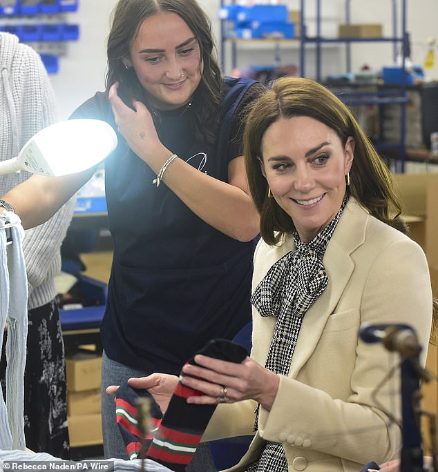 The Princess of Wales meets members of the production team during a visit to Corgi, a textiles manufacturer in Ammanford, South Wales on January 30