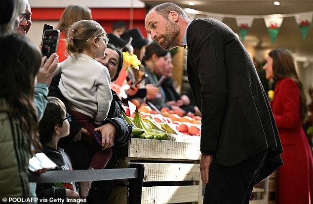 William appeared delighted as he chatted with wellwishers around the market in Wales this afternoon