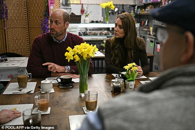 William and Kate listened attentively as they chatted with others about the flooding in Wales recently