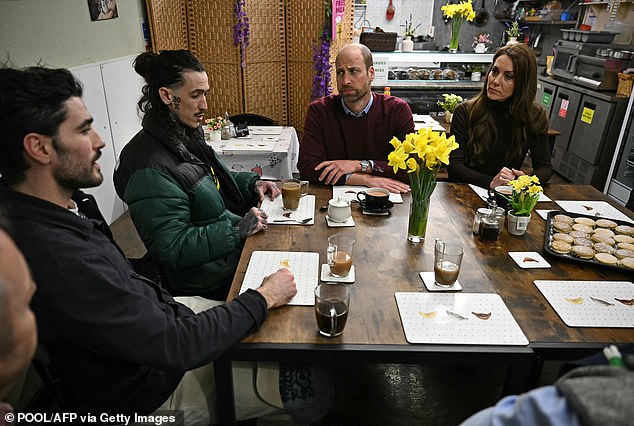 The royal pair sat next to one another as they chatted with people over cups of tea and baked goods