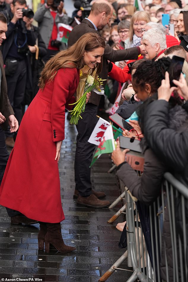 Kate was delighted as she was presented with daffodil bouquets while chatting with wellwishers today