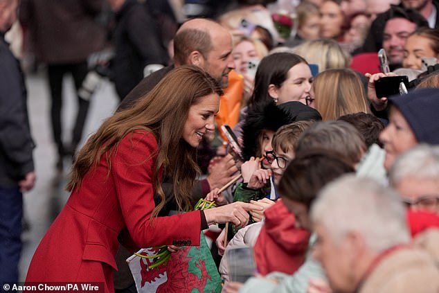 William and Kate both chatted with excited crowds during the outing in Wales together this afternoon