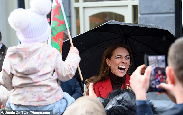 Kate couldn't hold back her glee as she laughed while meeting wellwishers in Wales earlier today