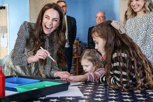 Richard Pohle - WPA Pool/Getty Catherine, Princess of Wales paints the hand of Maggie aged 4 years old whose sibling is being treated at TA Hafan, a children's hospice based in Sully, near Cardiff. which supports families in Wales to ensure that children with life-shortening conditions live fulfilling lives. The painted hand will be digitised and put on a wall of hand prints inside the hospice , on Jan. 30, 2025 in Sully, Wales