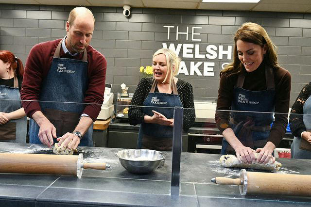 BEN STANSALL/POOL/AFP via Getty Prince William and Kate Middleton make Welsh cakes in Wales on Feb. 26, 2025