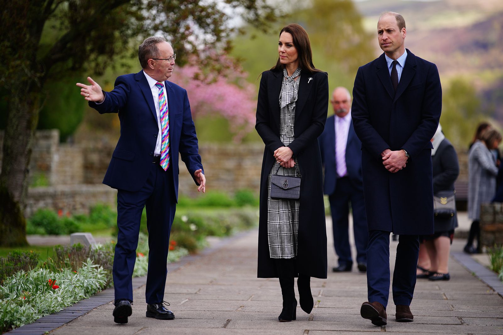 Image may contain Prince William Duke of Cambridge Person Adult Accessories Formal Wear Tie Bag and Handbag