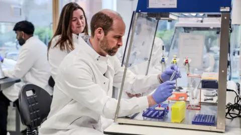 Richard Pohle/The Times/PA Wire The Prince of Wales makes a mini extraction of DNA, during a visit to 2024 Earthshot Prize finalist, NatureMetrics, in Guildford, Surrey