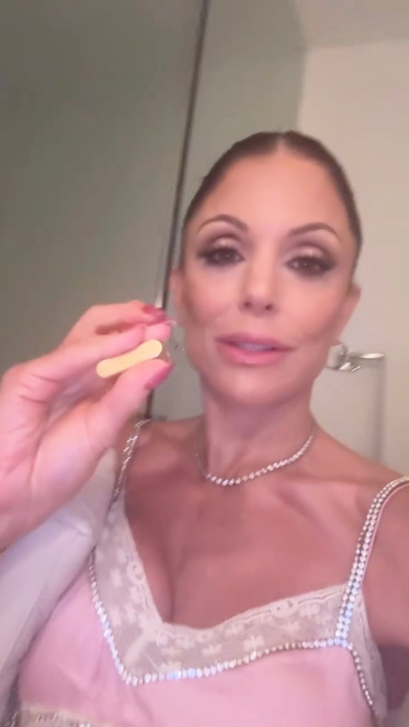 Bethenny Frankel holding a doorknob