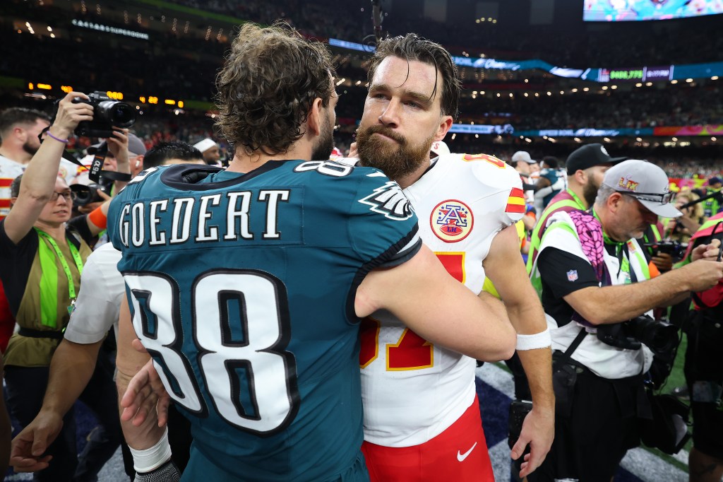 Dallas Goedert #88 of the Philadelphia Eagles and Travis Kelce #87 of the Kansas City Chiefs meet after Philadelphia beat Kansas City 40-22 to win Super Bowl LIX at Caesars Superdome on February 09, 2025 in New Orleans.