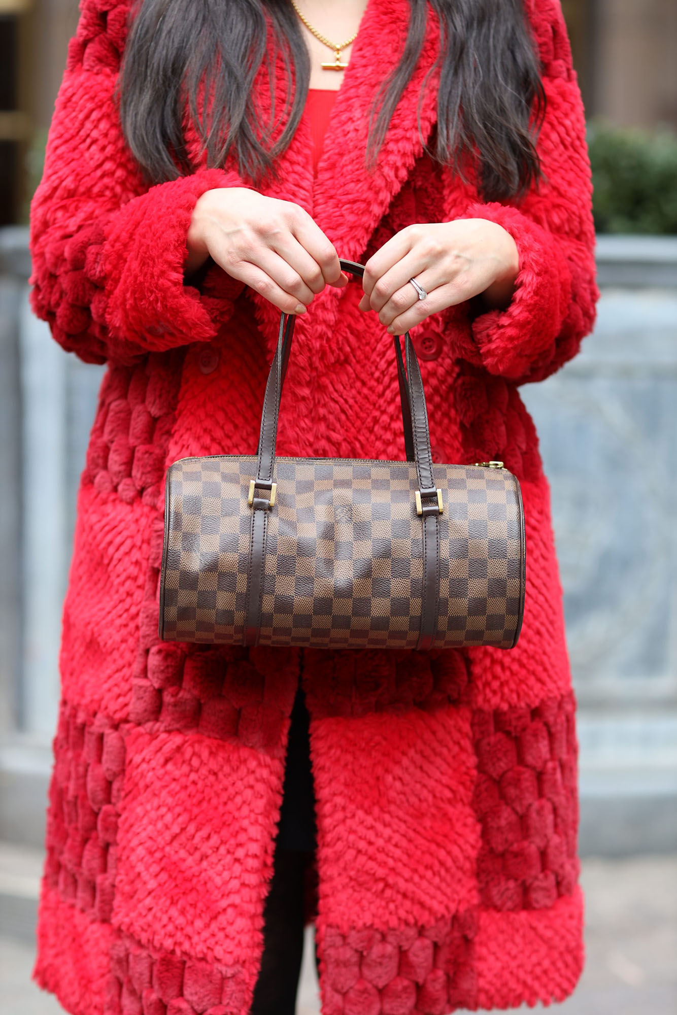 The author wearing a red faux fur coat