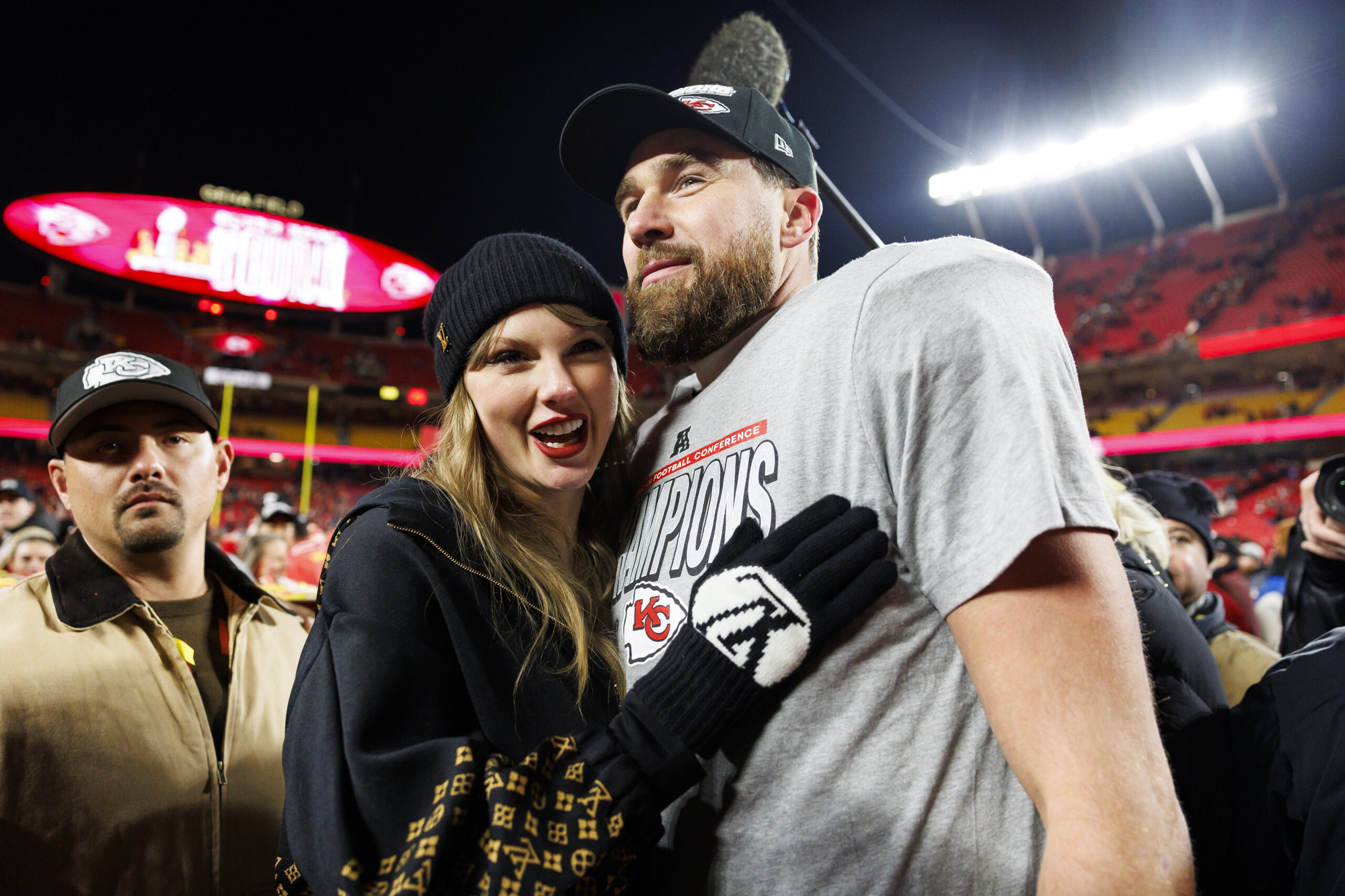 Taylor Swift hugging Travis Kelce.