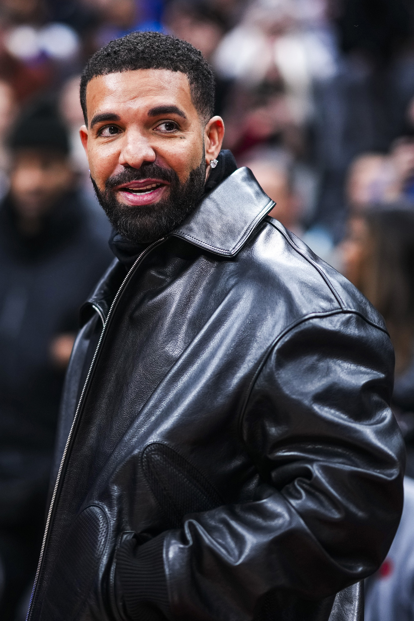 Drake in a leather jacket.